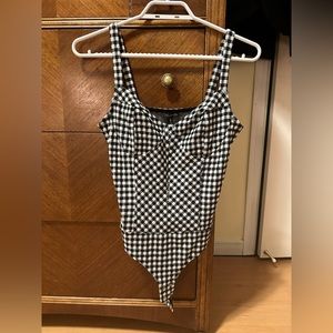 Black and white checkered bodysuit from Dynamite